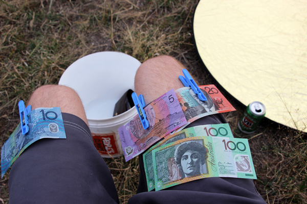 Money pegged to shorts during Stuart McMillen's Aussie crowdfunding video shoot