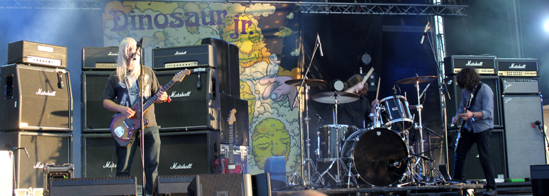 Dinosaur Jr. performing live at a festival outdoors