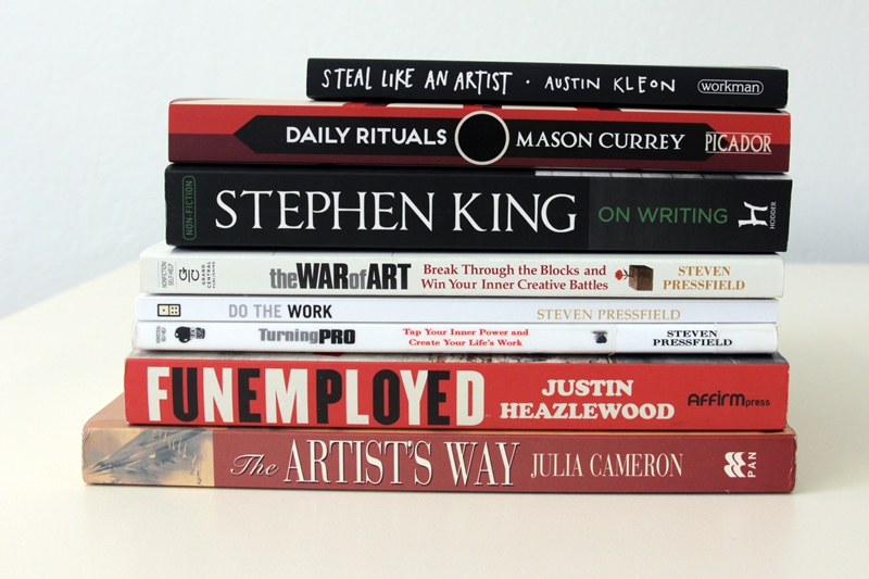 Pile of books about the challenges of artists and freelancers