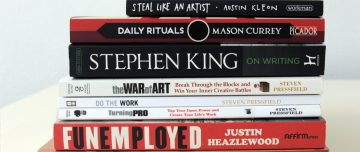 Pile of books about the challenges of artists and freelancers