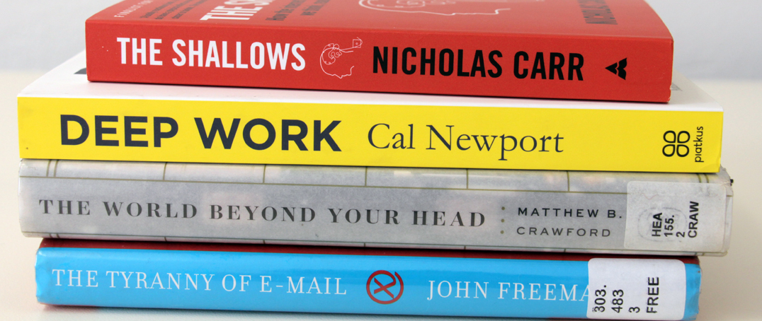 Pile of books about concentration, productivity, and distraction