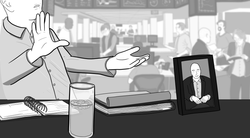 Cartoon illustration of businessman sitting at desk in open-plan office talking with his hands, with photo frame and glass of water on desktop.