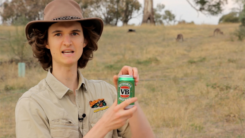 Stuart McMillen holding a can of VB beer