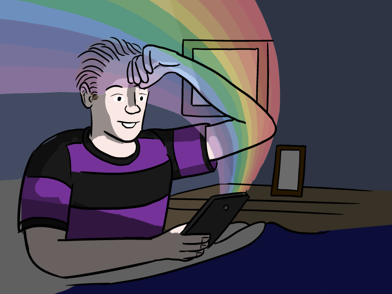 Young man in a dark room with face illuminated by rainbow light coming from device