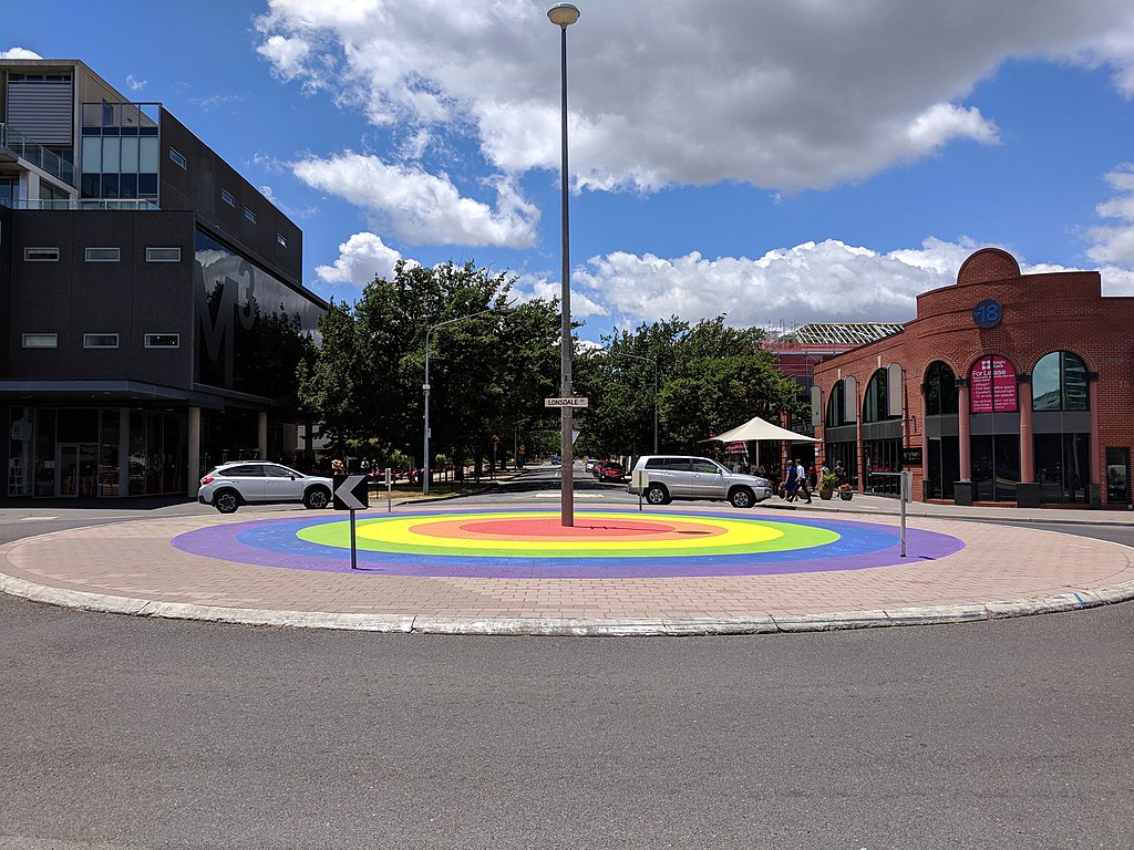 Street-level view of rainbow roundabout in Canberra