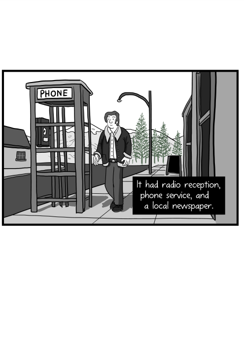 It had radio reception, phone service, and a local newspaper. Cartoon of man walking along a street near a phone booth in small town.