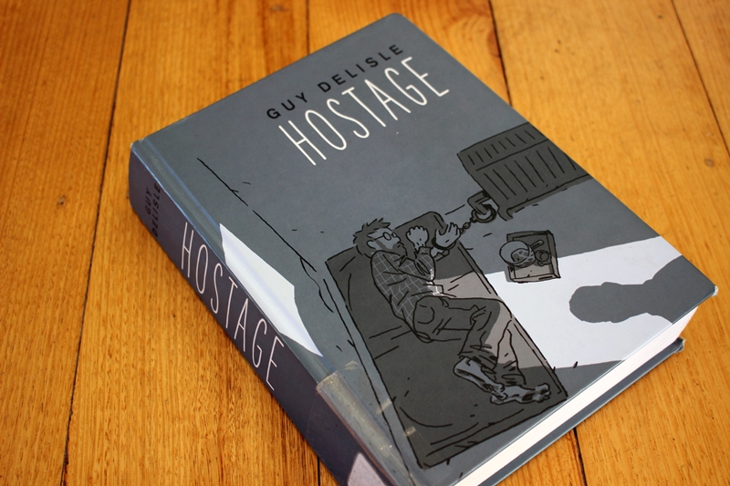 Guy Delisle - Hostage - book cover on table