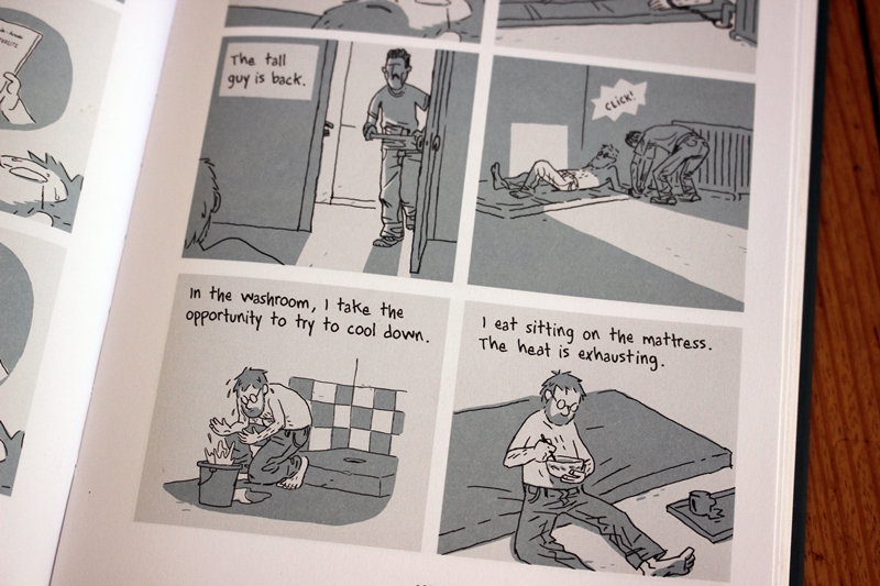 Pages from 'Hostage' by Guy Delisle - p185 - the tall guy is back, washroom