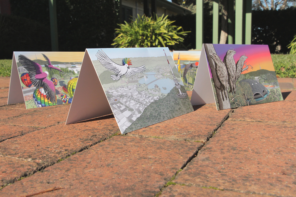 Side view of greeting cards standing next to each other