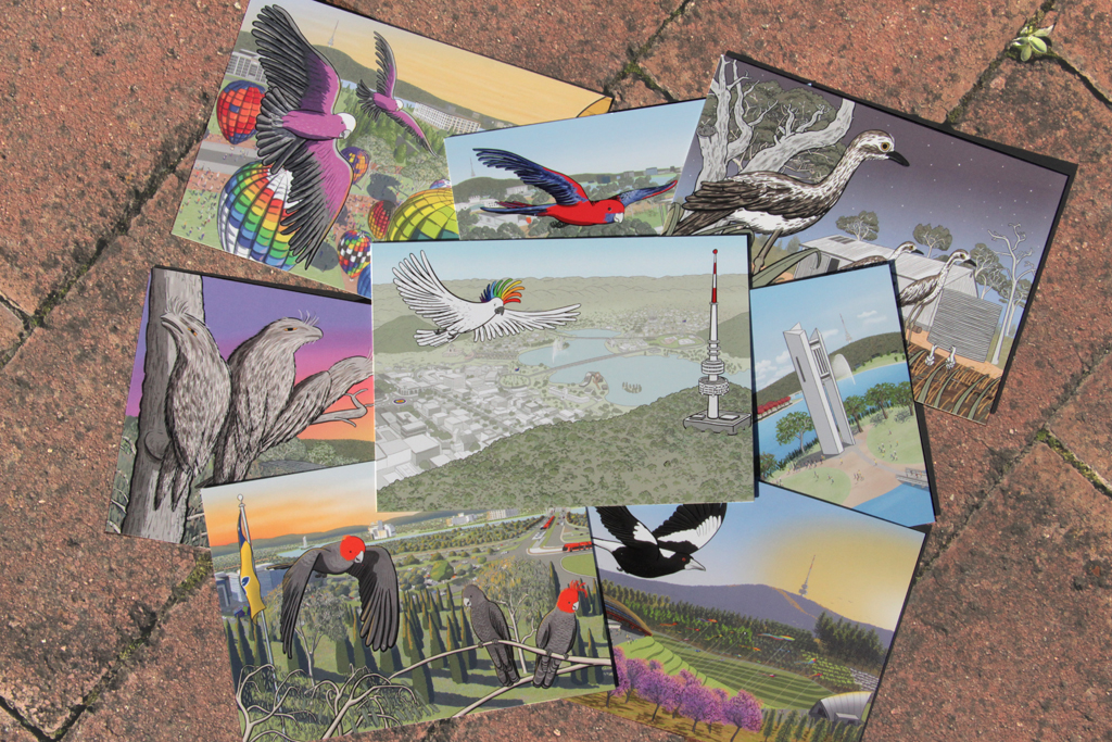 Arrangement of eight colourful postcards on the ground