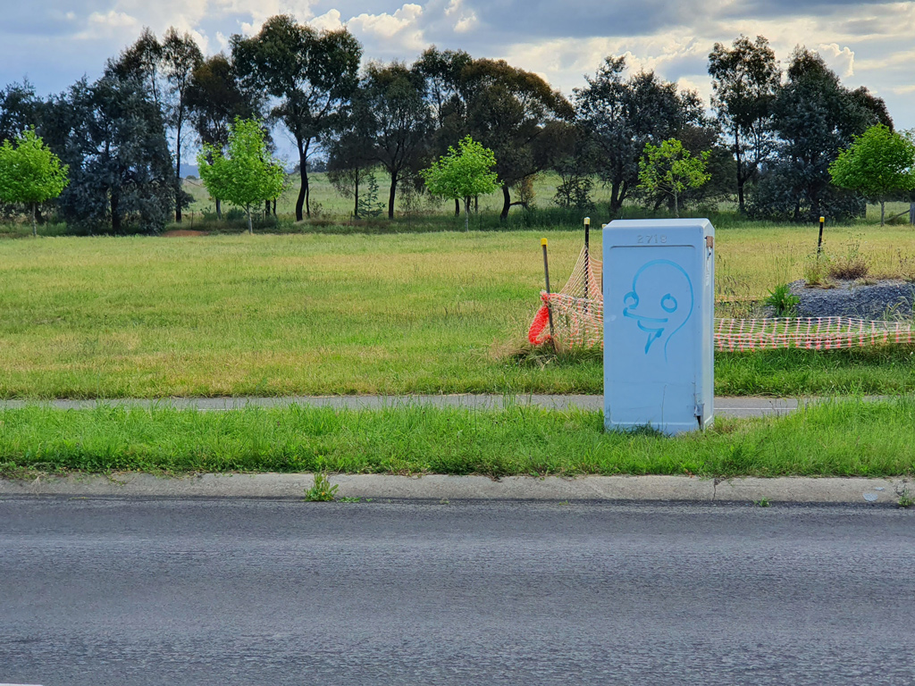 Alien dude graffiti on Ginninderra Drive cabinet box