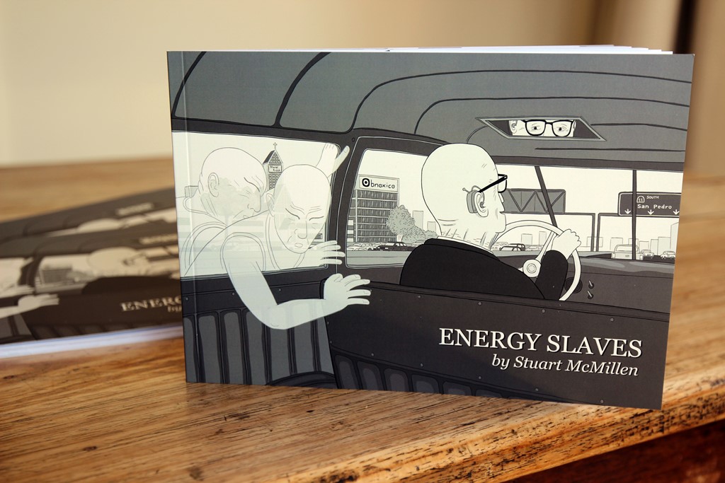 Energy Slaves comic book displayed on a table